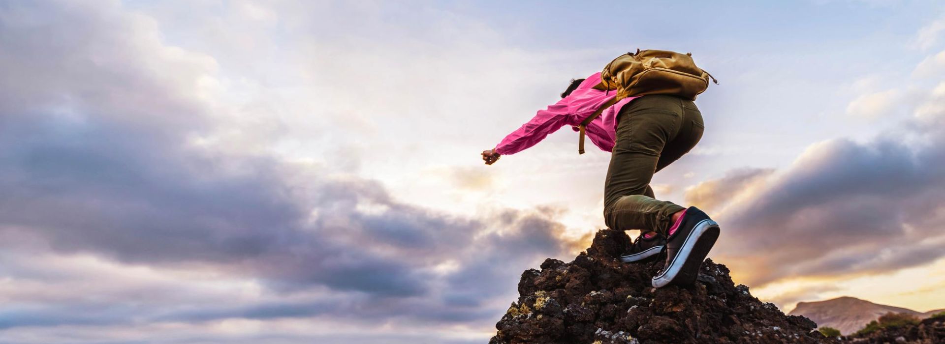 A person climbs a mountain.