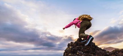 A person climbs a mountain.