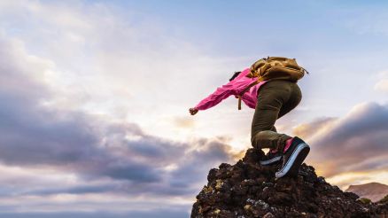 A person climbs a mountain.